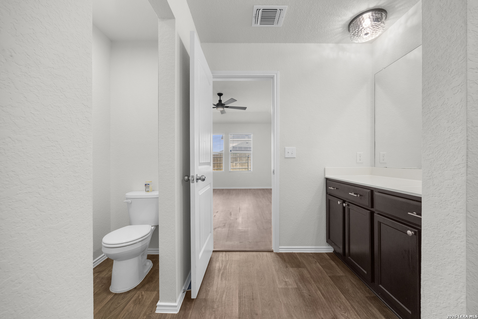 14809 Bajada Road Manor, TX 78653 - Photo 19 of 30 a bathroom with a sink and a toilet