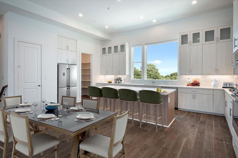 4066 Oak Circle Addison, TX 75001 - Photo 1 of 30 a kitchen with a dining table chairs and refrigerator