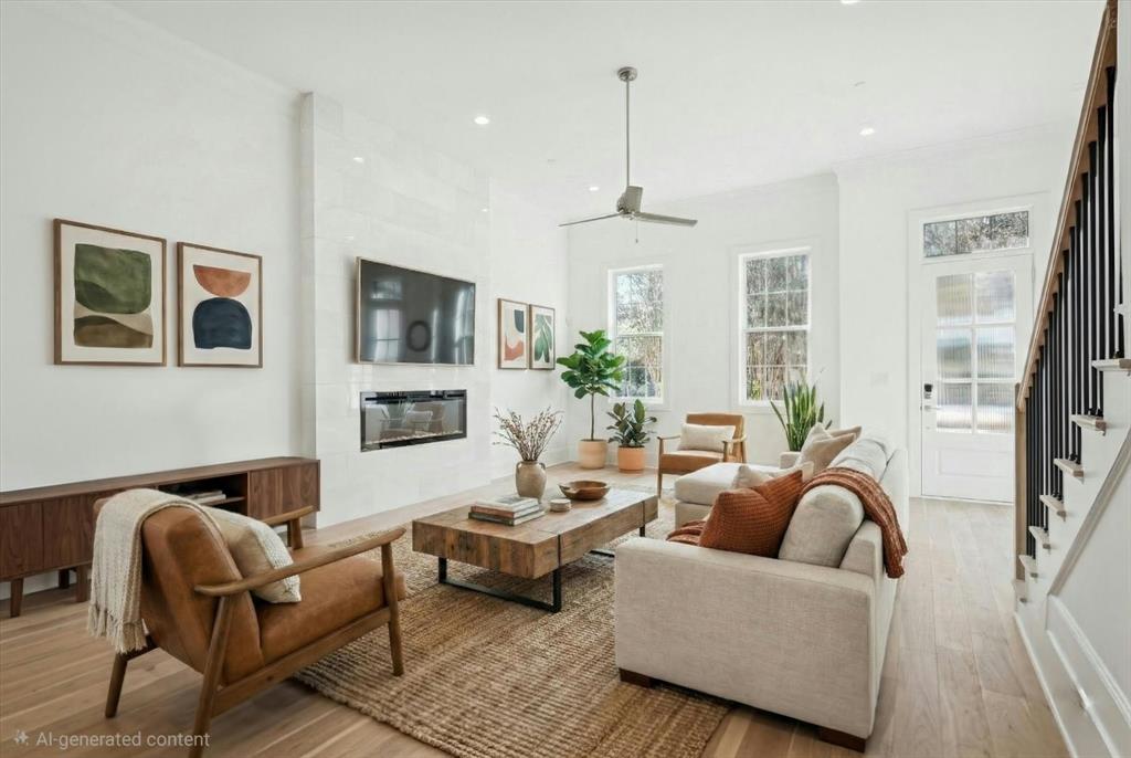a living room with furniture ceiling fan and a rug