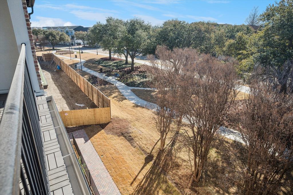 4066 Oak Circle Addison, TX 75001 - Photo 11 of 31 a view of a balcony with mountain view and wooden floor