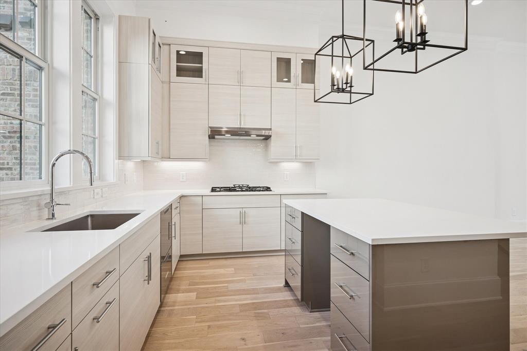 4066 Oak Circle Addison, TX 75001 - Photo 12 of 31 a kitchen with white cabinets and sink