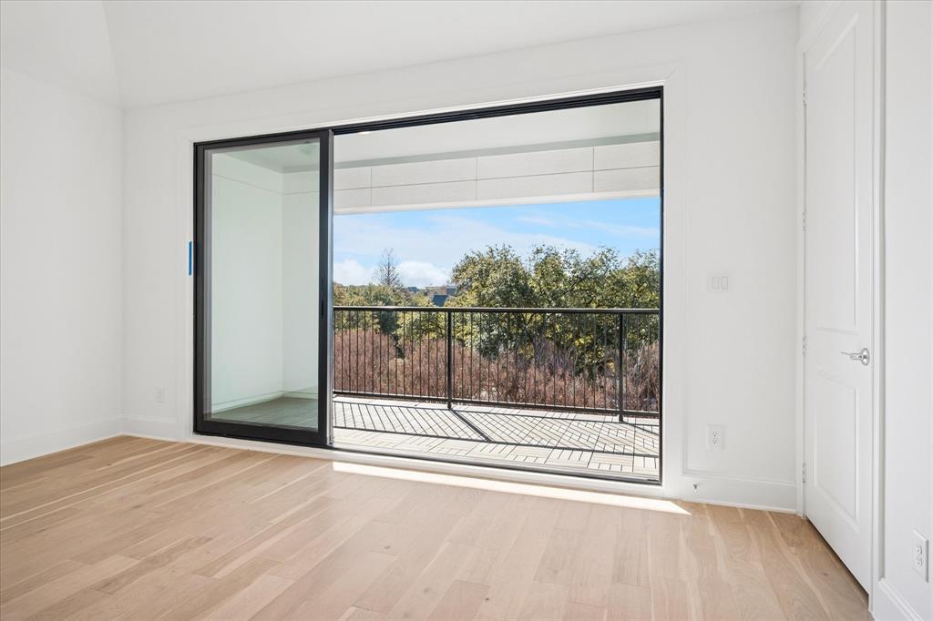 4066 Oak Circle Addison, TX 75001 - Photo 14 of 31 a view of a room with wooden floor and window