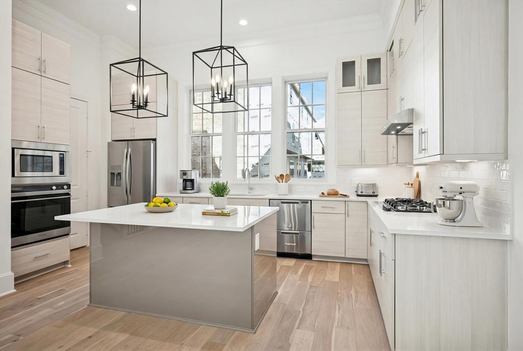 4066 Oak Circle Addison, TX 75001 - Photo 2 of 31 a kitchen with white cabinets stainless steel appliances and sink