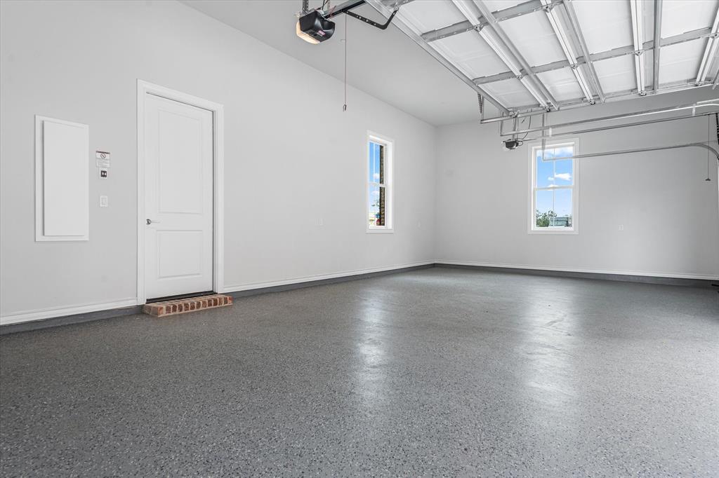 4066 Oak Circle Addison, TX 75001 - Photo 27 of 30 an empty room with wooden floor and windows