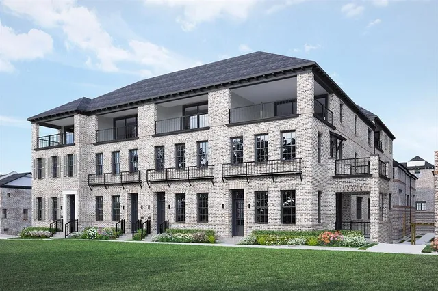 front view of a building with a yard