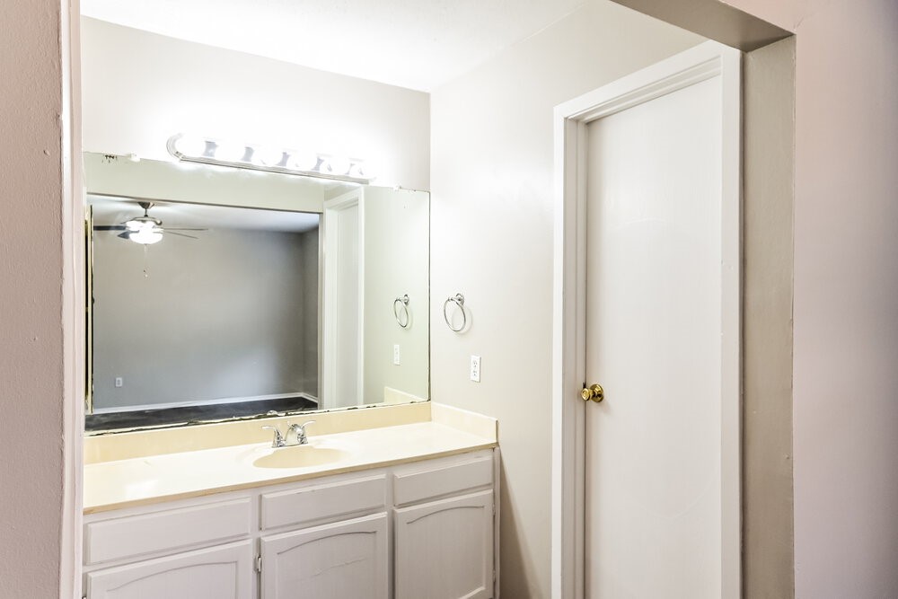 2703 Wood River Road Spring, TX 77373 - Photo 11 of 16 a bathroom with a sink and a mirror