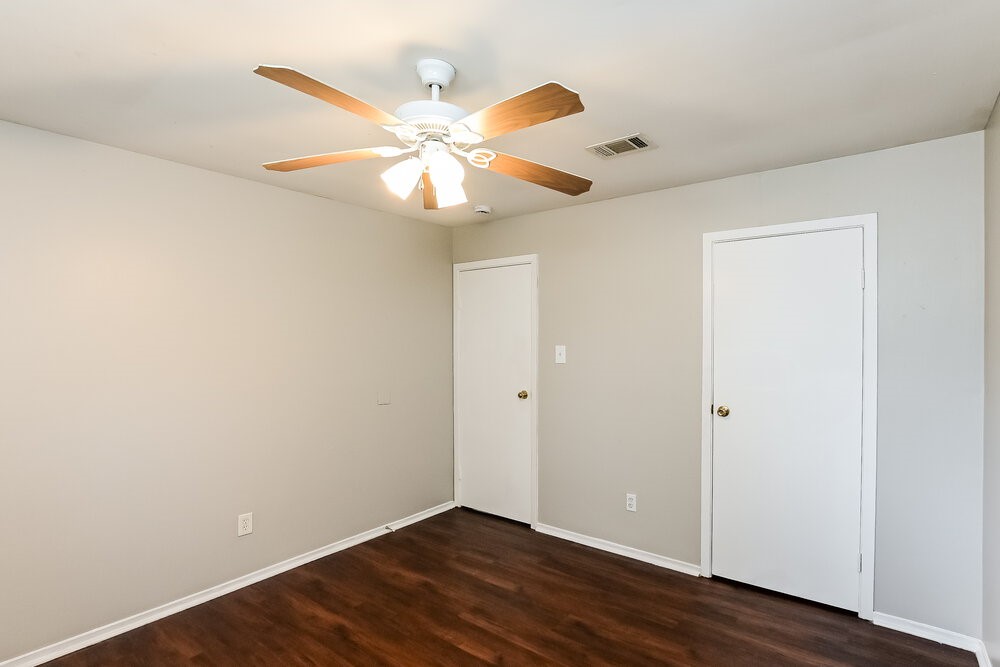 2703 Wood River Road Spring, TX 77373 - Photo 12 of 16 an empty room with wooden floor and windows