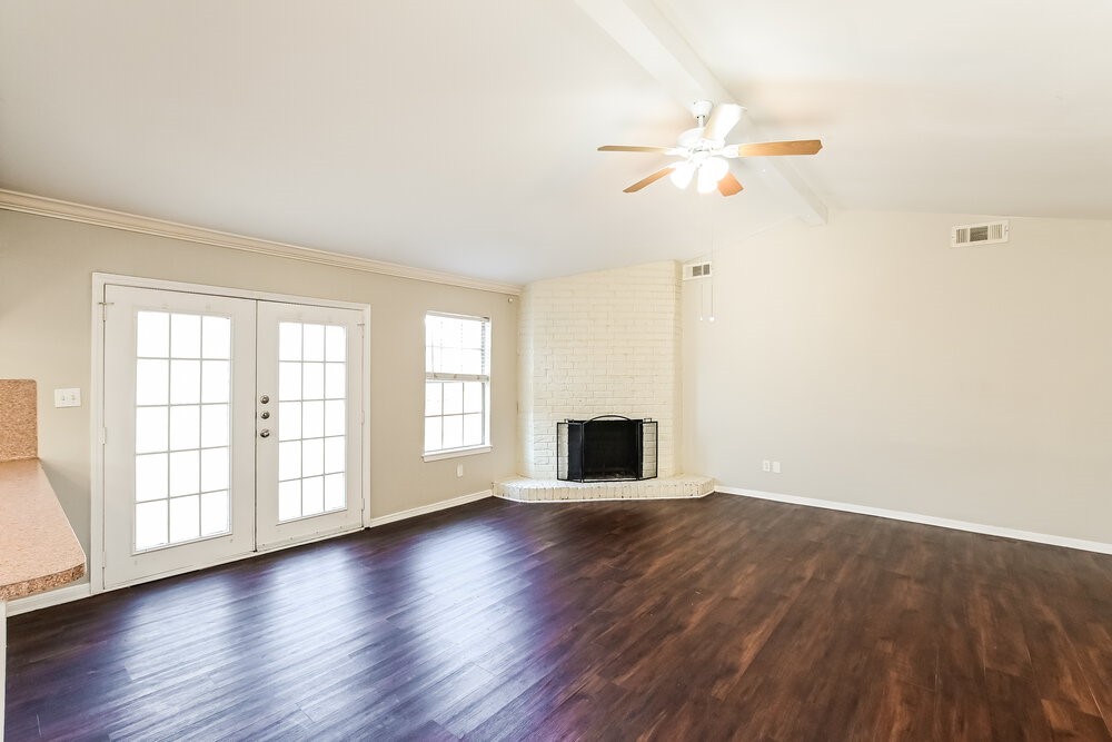 2703 Wood River Road Spring, TX 77373 - Photo 4 of 16 a view of empty room with wooden floor and fan