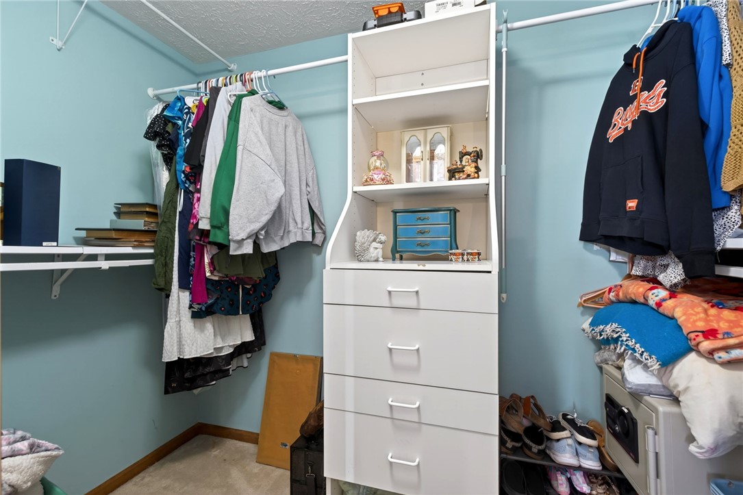 4996 Shannon Avenue Springfield, OH 45504 - Photo 38 of 61 This closet features efficient storage solutions with built-in shelving and hanging rods for optimal organization.