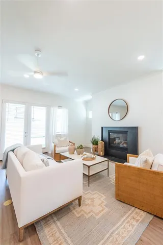 a living room with fireplace furniture and a fireplace