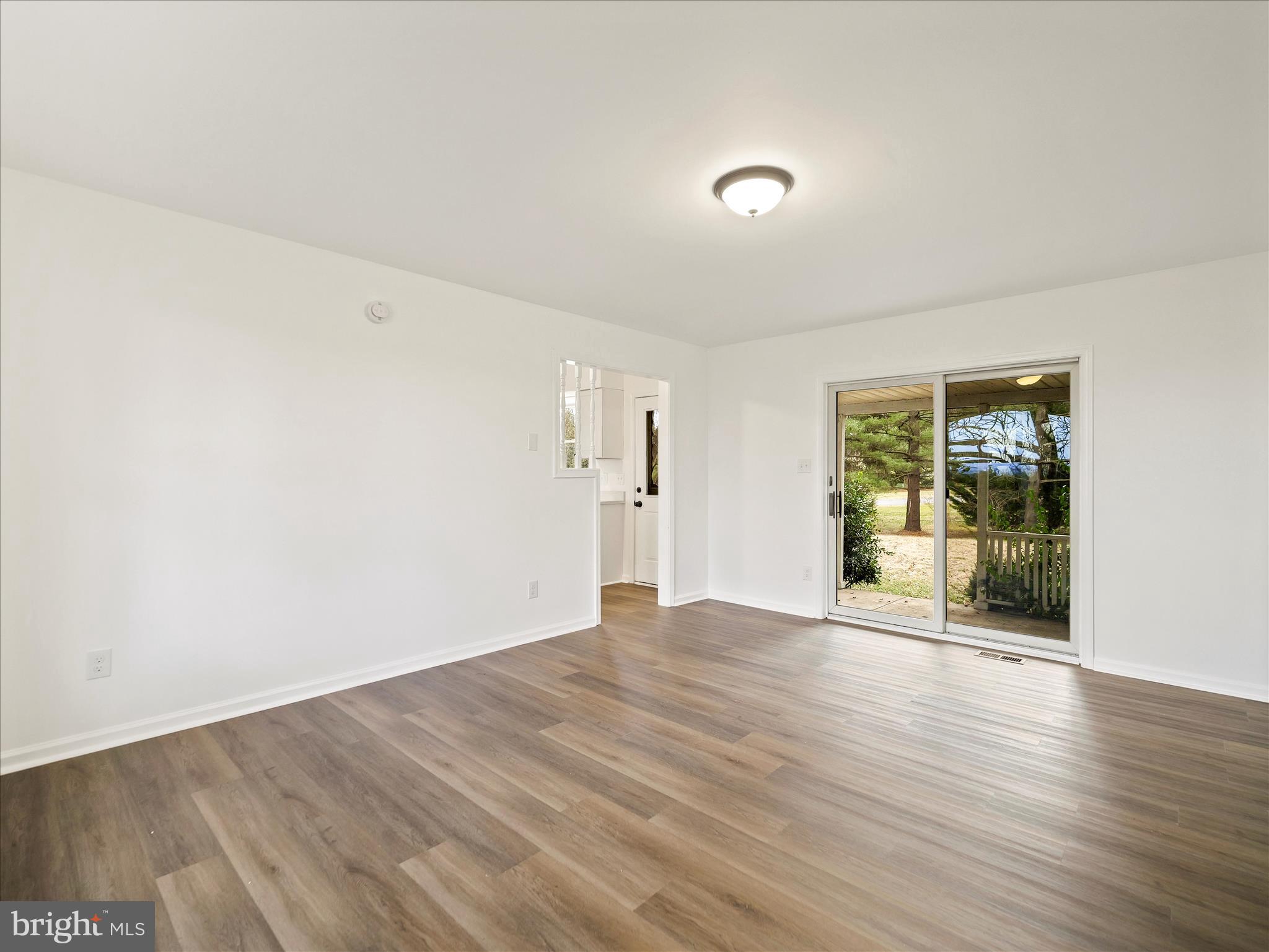 6824 Rice Road Shippensburg, PA 17257 - Photo 15 of 35 a view of an empty room with wooden floor and a window