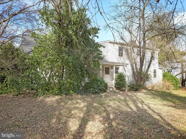 a view of a house with a tree