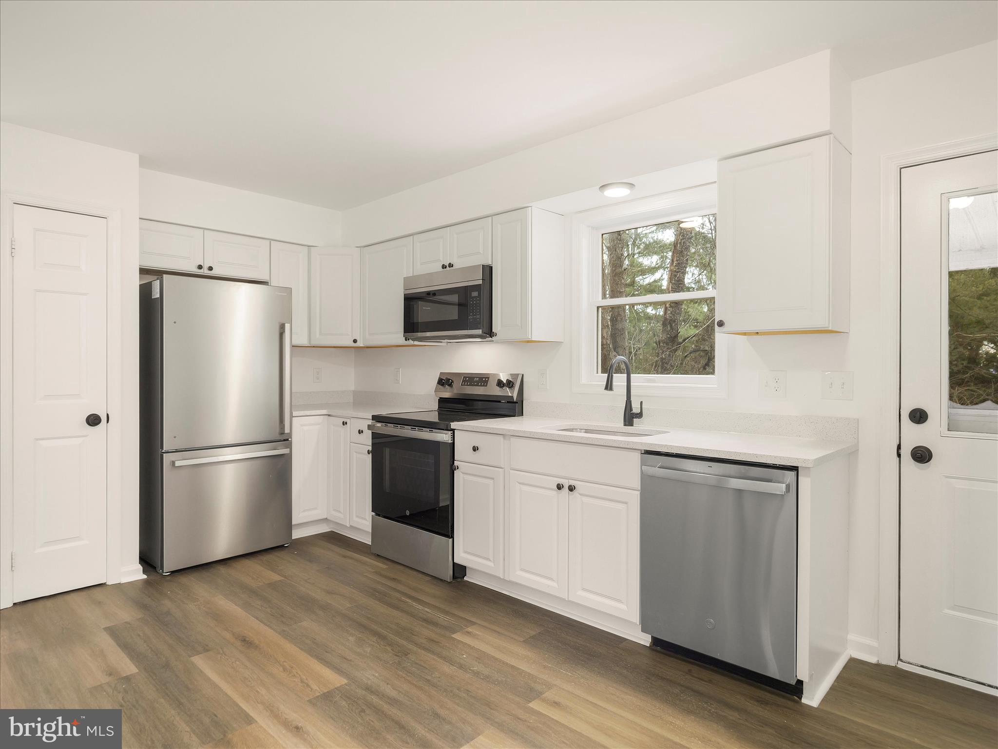6824 Rice Road Shippensburg, PA 17257 - Photo 4 of 35 a kitchen with a refrigerator stove and sink