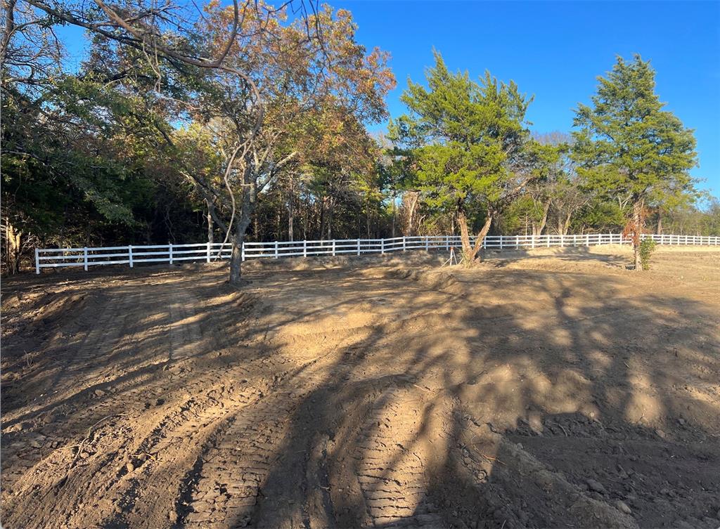 738 Campground Road Sherman, TX 75090 - Photo 12 of 40 a view of a yard with trees in the background
