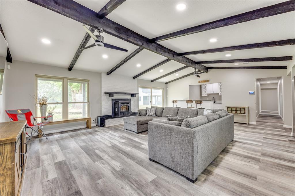 738 Campground Road Sherman, TX 75090 - Photo 16 of 40 a living room with furniture a flat screen tv and a large window