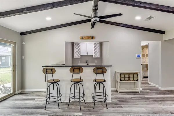 a kitchen with granite countertop a sink and a window
