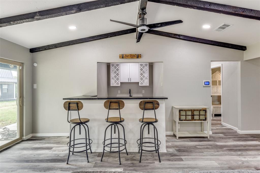 738 Campground Road Sherman, TX 75090 - Photo 22 of 40 a view of a kitchen with furniture and wooden floor