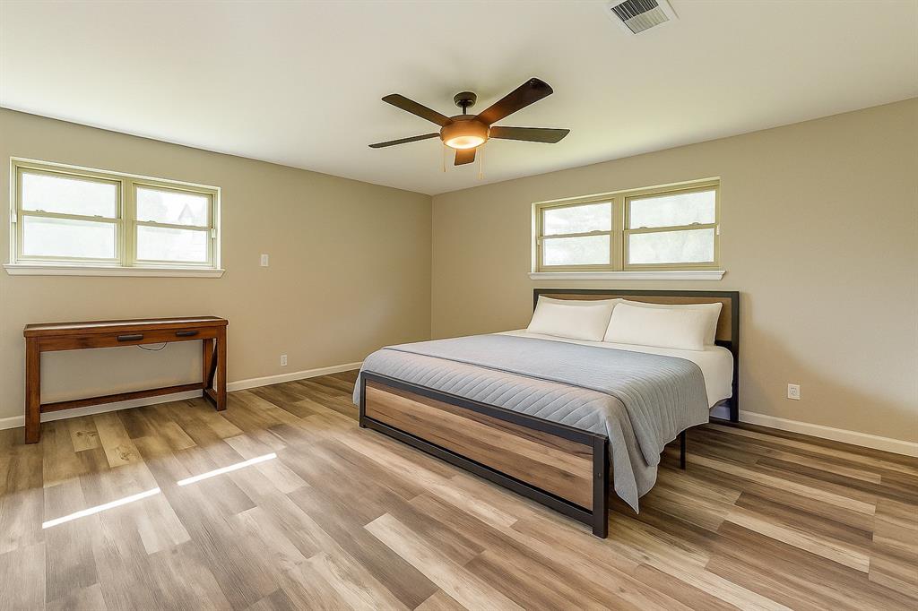 738 Campground Road Sherman, TX 75090 - Photo 24 of 40 a bedroom with a bed and a ceiling fan