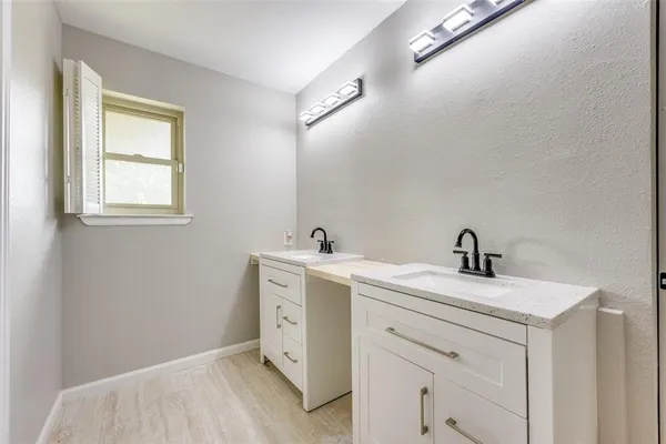 a bedroom with a bed and a ceiling fan