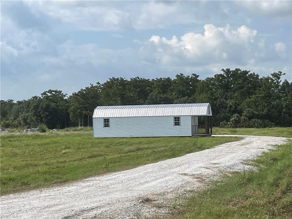 46310 Neal Road Punta Gorda, FL 33982 - Photo 5 of 18 View of new driveway leading to the 50x50 building pad and 12x40 shed