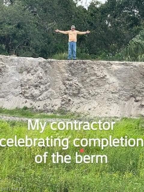 46310 Neal Road Punta Gorda, FL 33982 - Photo 9 of 18 Building a berm...