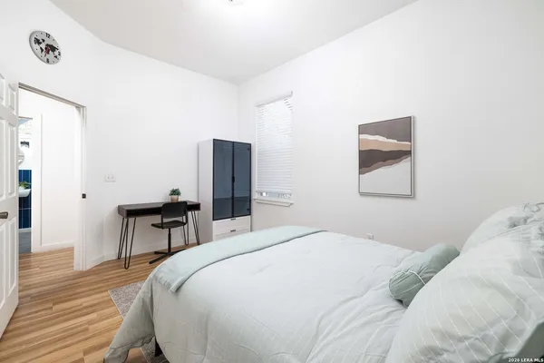 a bedroom with a bed and a table