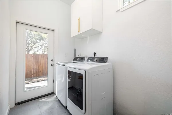 a utility room with dryer and washer
