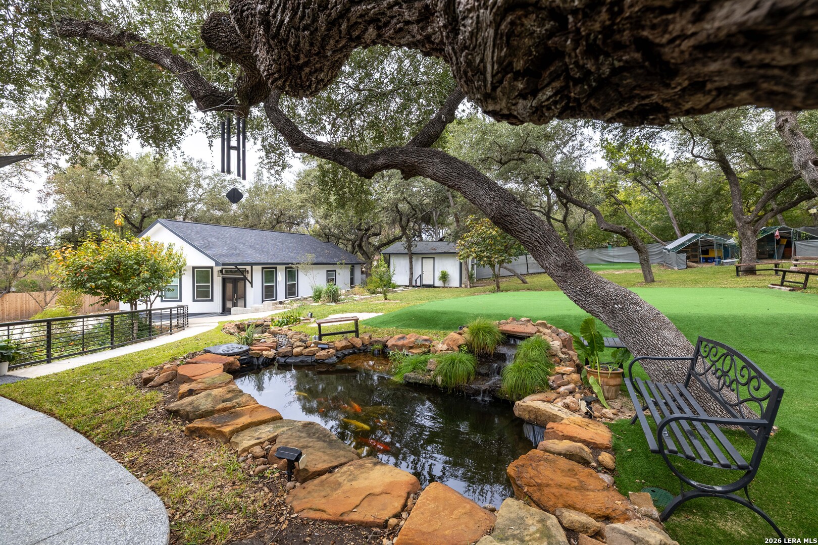 9263 Cinchona Trail Garden Ridge, TX 78266 - Photo 27 of 29 a view of a house with a yard
