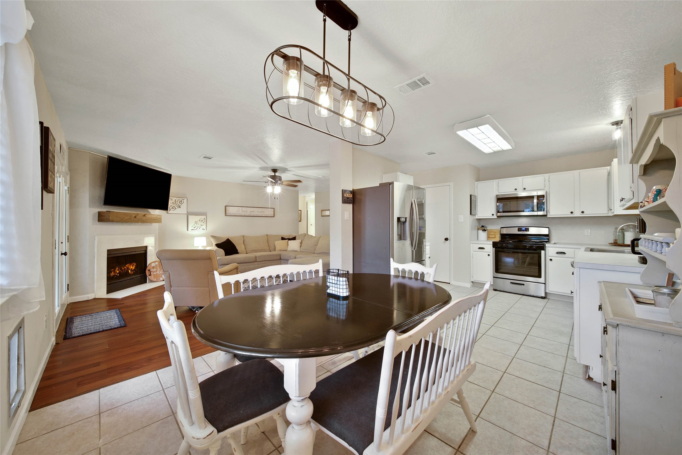 4843 Drew Forest Lane Humble, TX 77346 - Photo 5 of 21 The breakfast nook overlooks the peaceful backyard and comfortable can fit a larger table. It is also open to the kitchen and living area.