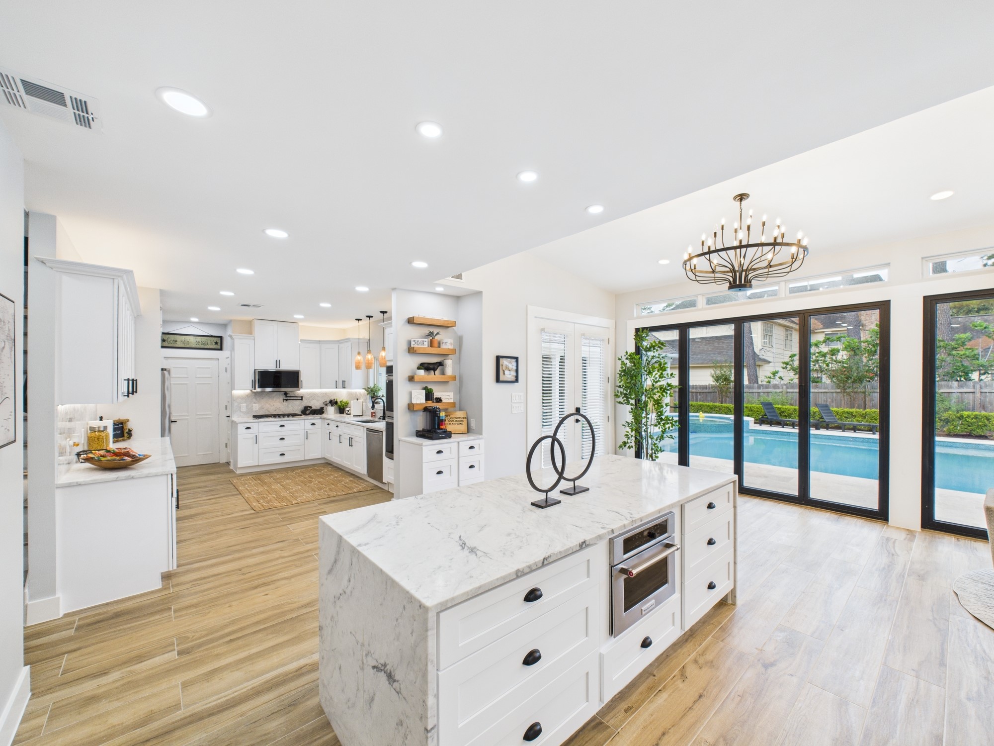 5430 Havenwoods Drive Houston, TX 77066 - Photo 12 of 50 a kitchen with stainless steel appliances kitchen island granite countertop a stove and a sink