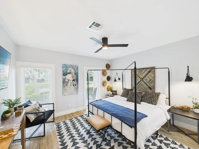 a living room with furniture and a table