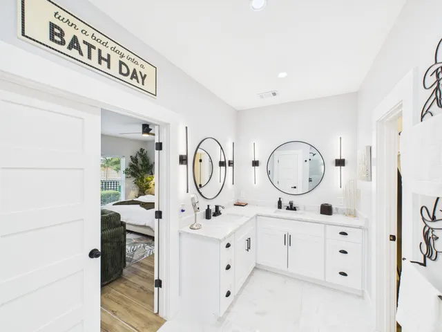 a bathroom with a double vanity sink and a mirror