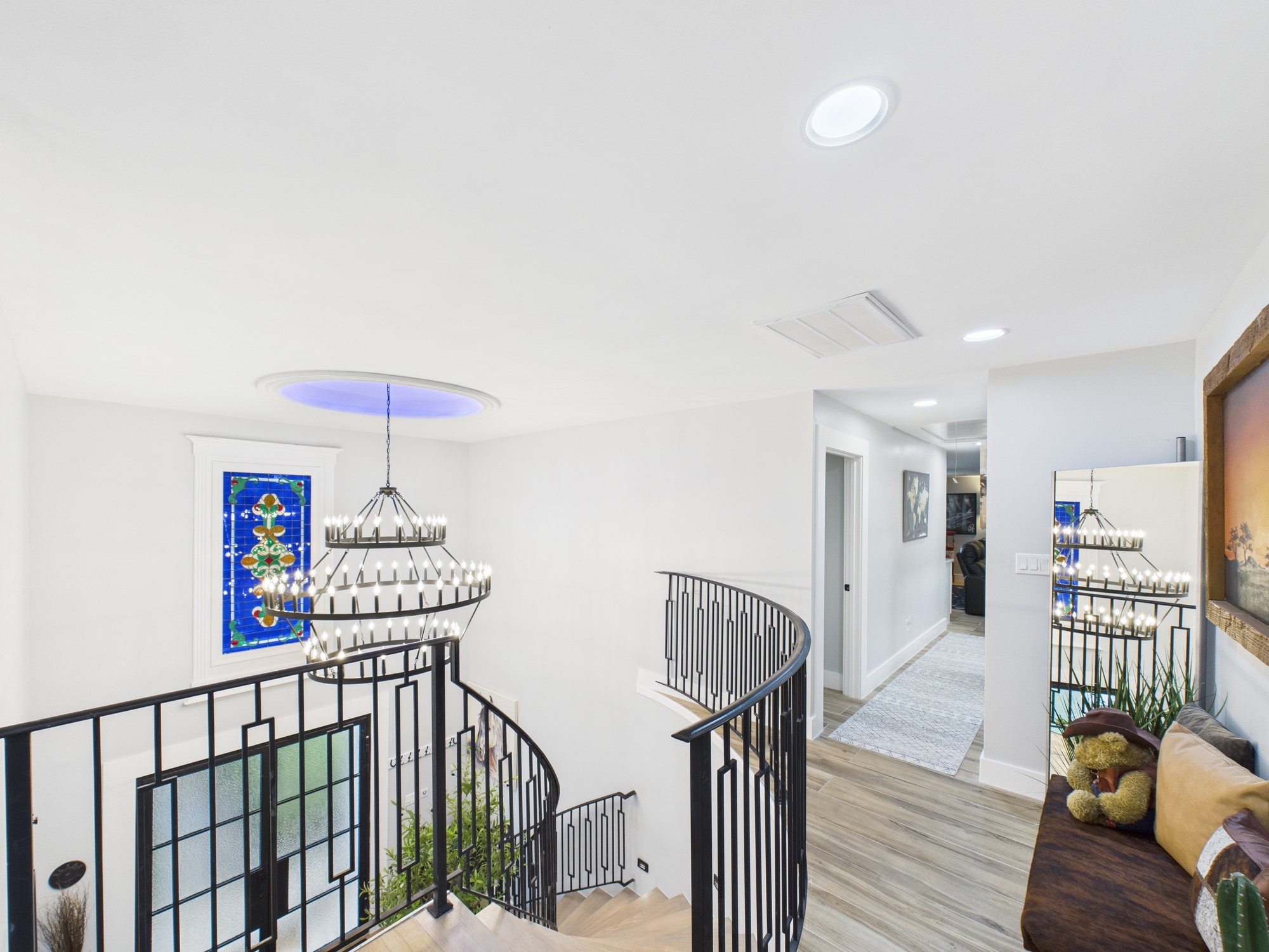5430 Havenwoods Drive Houston, TX 77066 - Photo 23 of 50 a view of a hallway with wooden floor and stairs