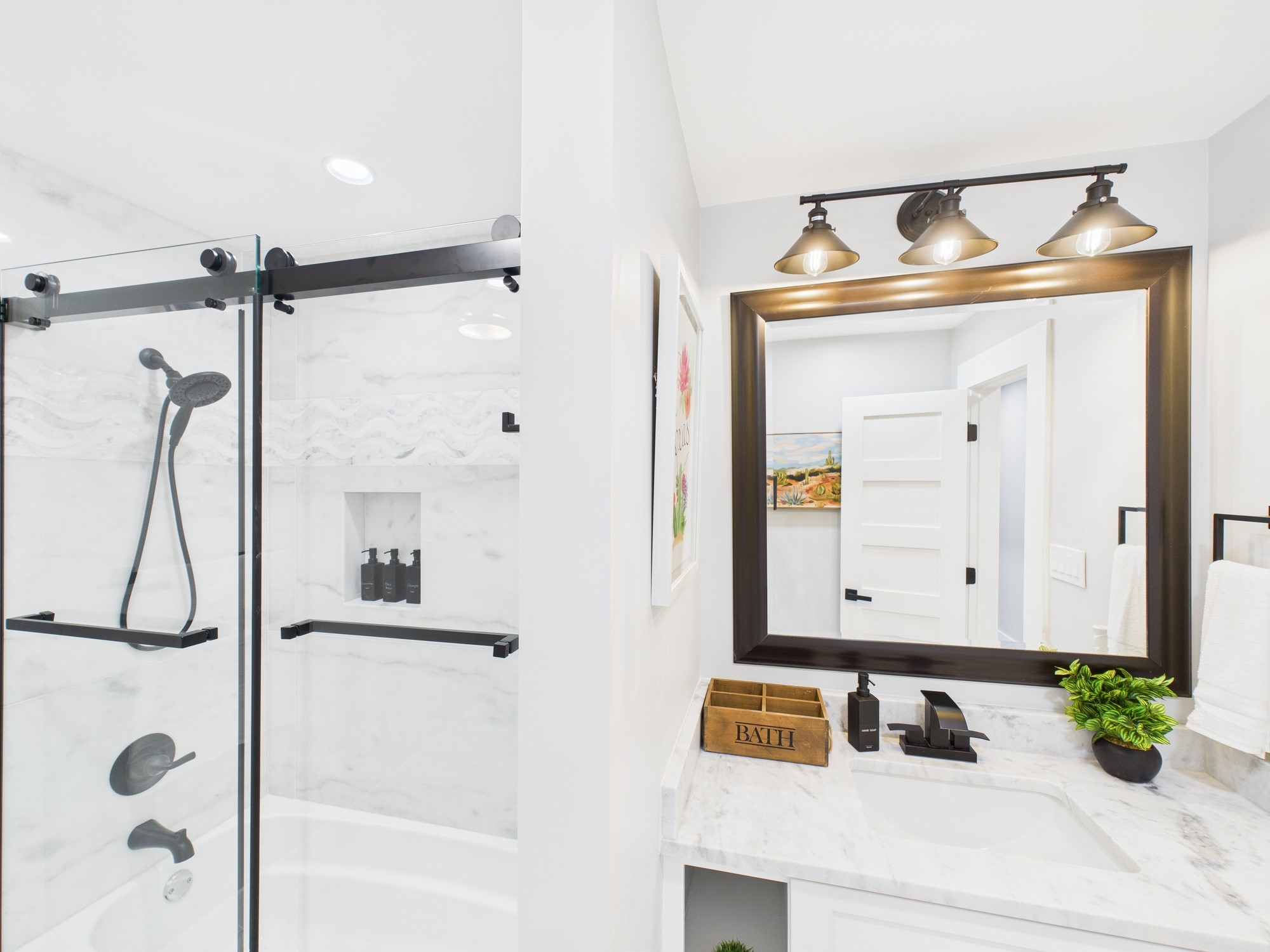 5430 Havenwoods Drive Houston, TX 77066 - Photo 32 of 50 a bathroom with a sink and a mirror