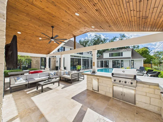 a living room with fireplace furniture and a flat screen tv