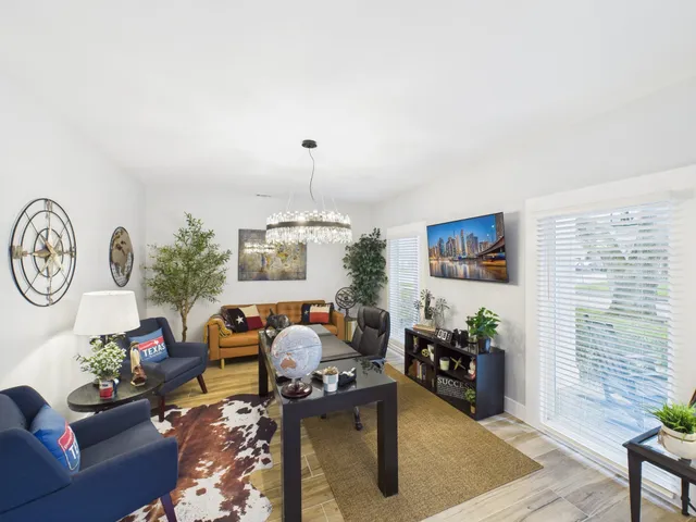 a living room with furniture and a window