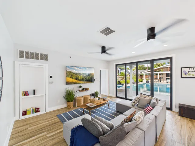 a living room with furniture and a large window