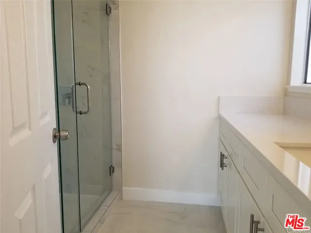 a bathroom with a sink and vanity