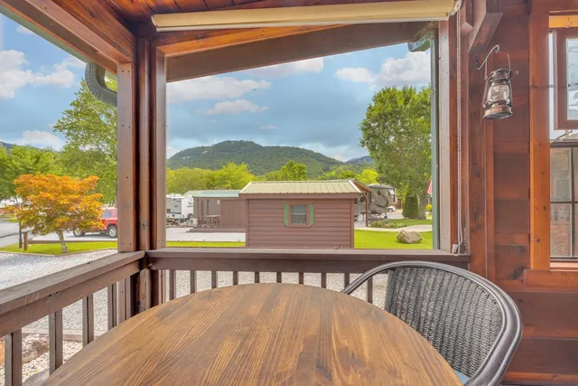 a view of a balcony with two chairs