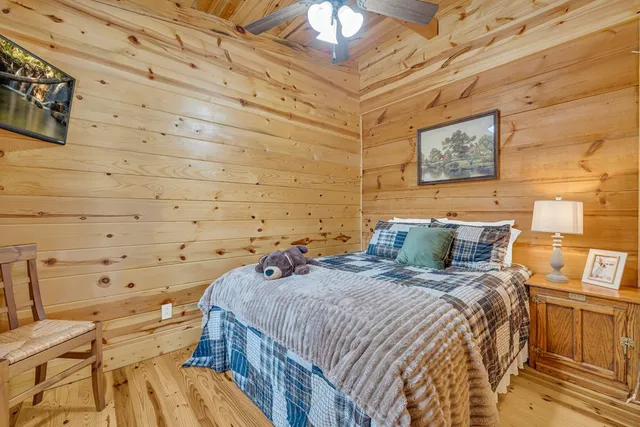 a bed sitting in a bedroom next to a wall