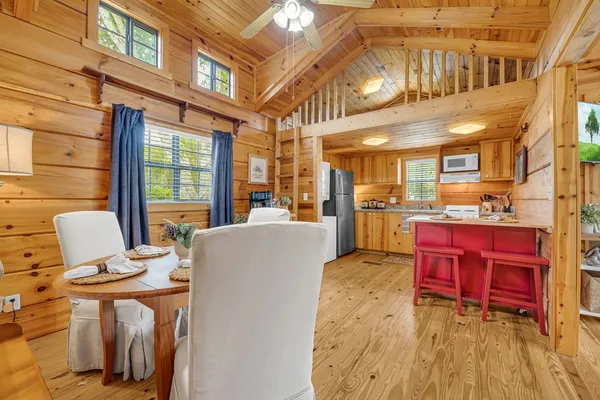 a view of a kitchen with seating area