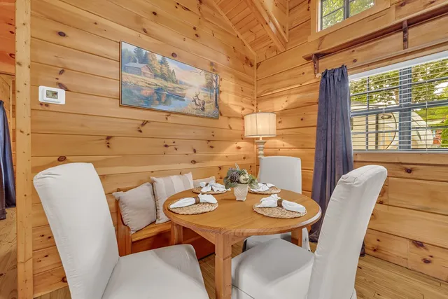 a view of a dining room with furniture window and outside view