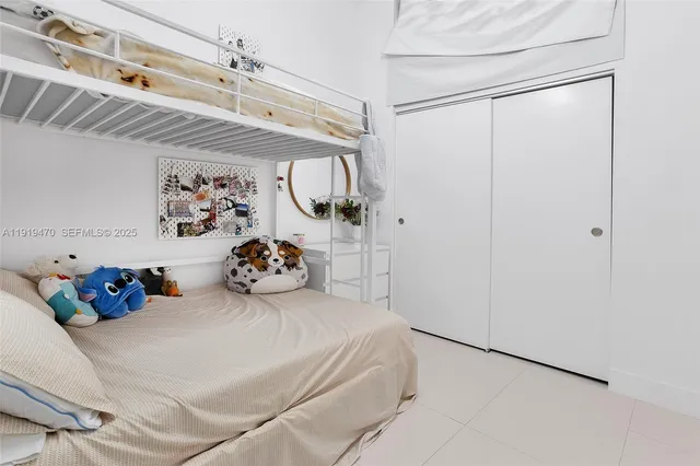 a bedroom with a bed and a walk in closet