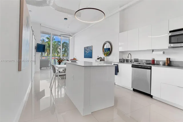 a kitchen with a sink cabinets and window