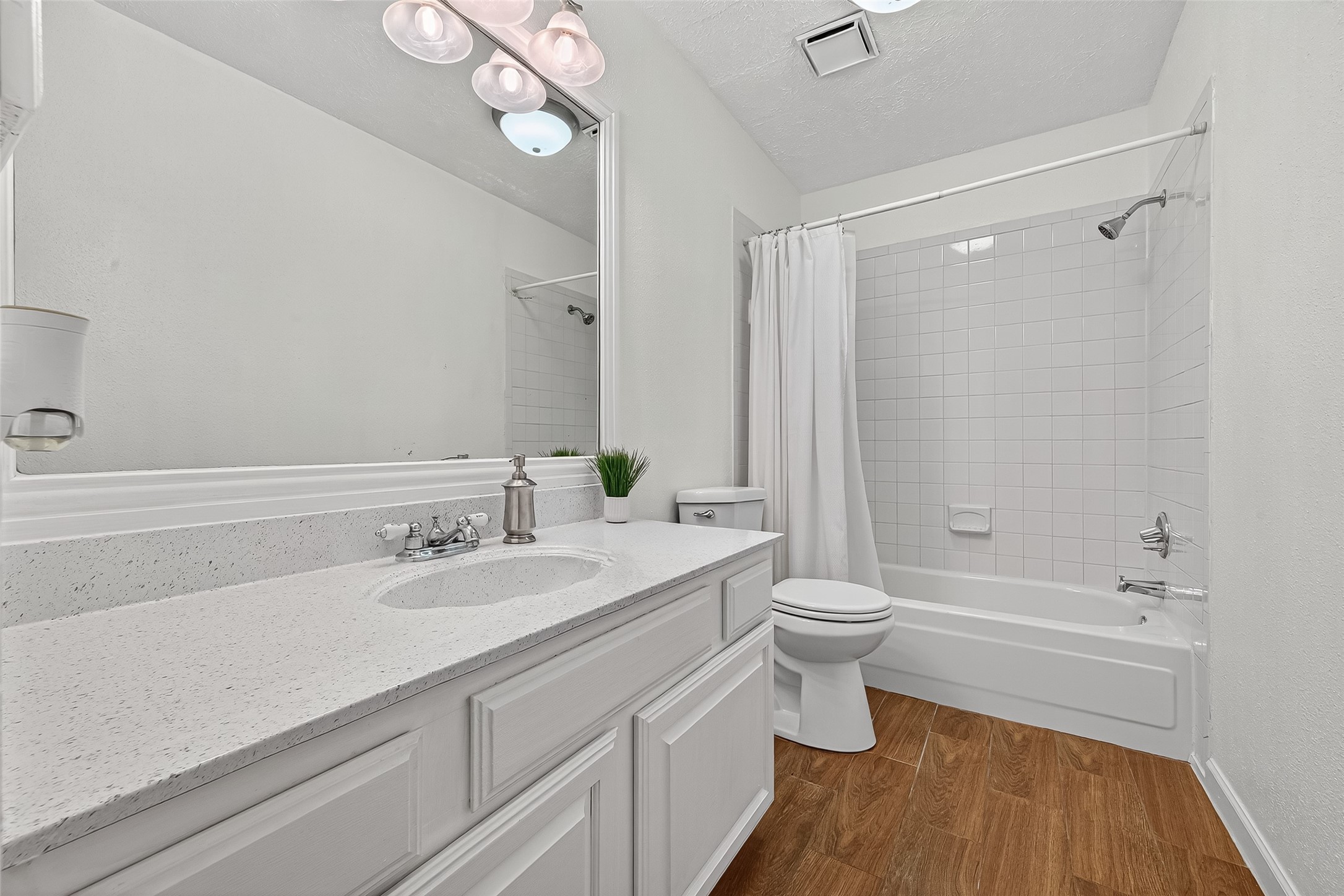 5323 Windsong Trail Houston, TX 77084 - Photo 23 of 30 Secondary Bathroom upstairs. The fresh paint, upated flooring and refinished vanity makes this a comfortable space for getting ready for the day!