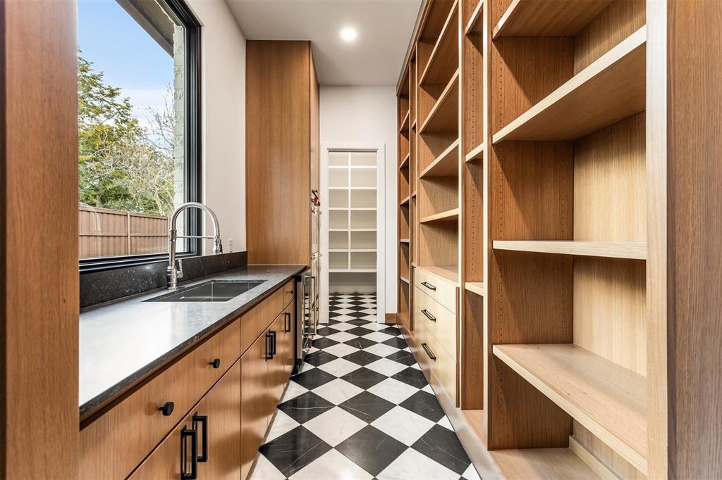 6123 Northaven Road Dallas, TX 75230 - Photo 13 of 40 Finished with the same level of detail as the main kitchen, the butler’s pantry adds functionality without sacrificing design or continuity