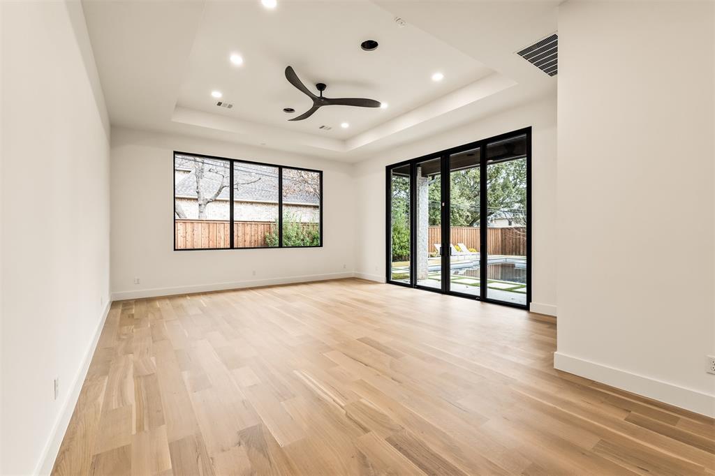 6123 Northaven Road Dallas, TX 75230 - Photo 17 of 40 The main floor bedroom/game room opens directly to the backyard, creating an easy indoor outdoor flow that works just as well for everyday hangouts as it does for entertaining