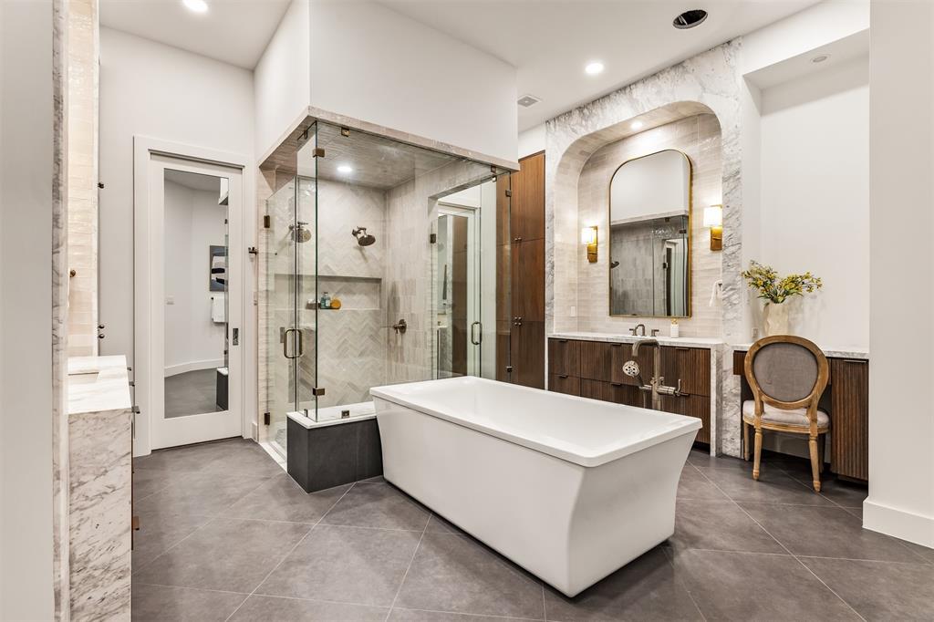 6123 Northaven Road Dallas, TX 75230 - Photo 23 of 40 The spa inspired ensuite features separate vanities, giving the bathroom a balanced, functional layout with plenty of personal space