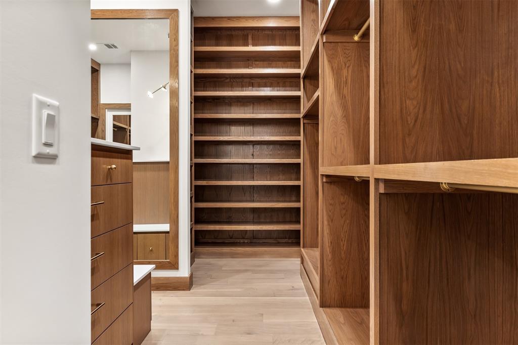 6123 Northaven Road Dallas, TX 75230 - Photo 25 of 40 The custom walk in closet is thoughtfully designed with built in storage that keeps everything organized and easy to access
