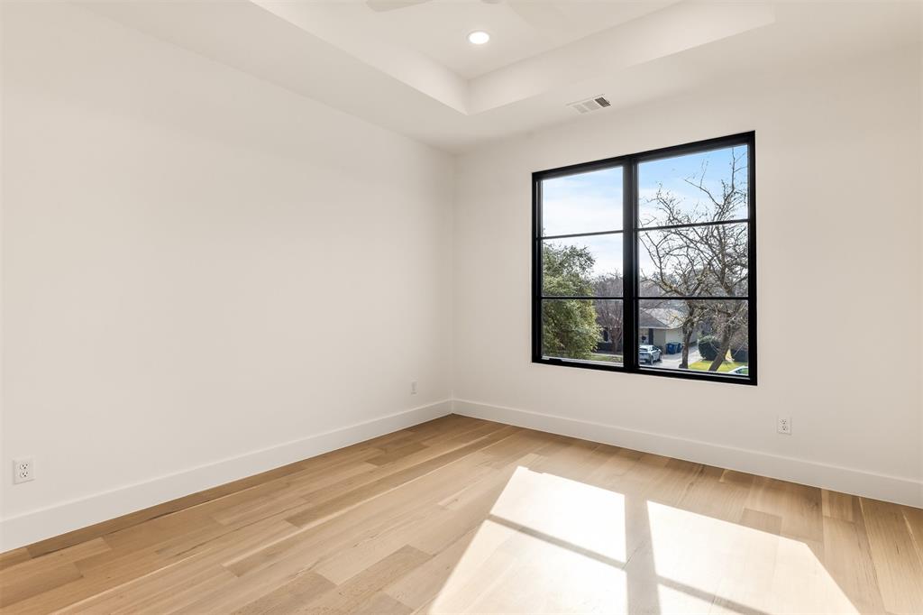 6123 Northaven Road Dallas, TX 75230 - Photo 33 of 40 Large windows bring natural light into the guest bedrooms, keeping each space bright and inviting